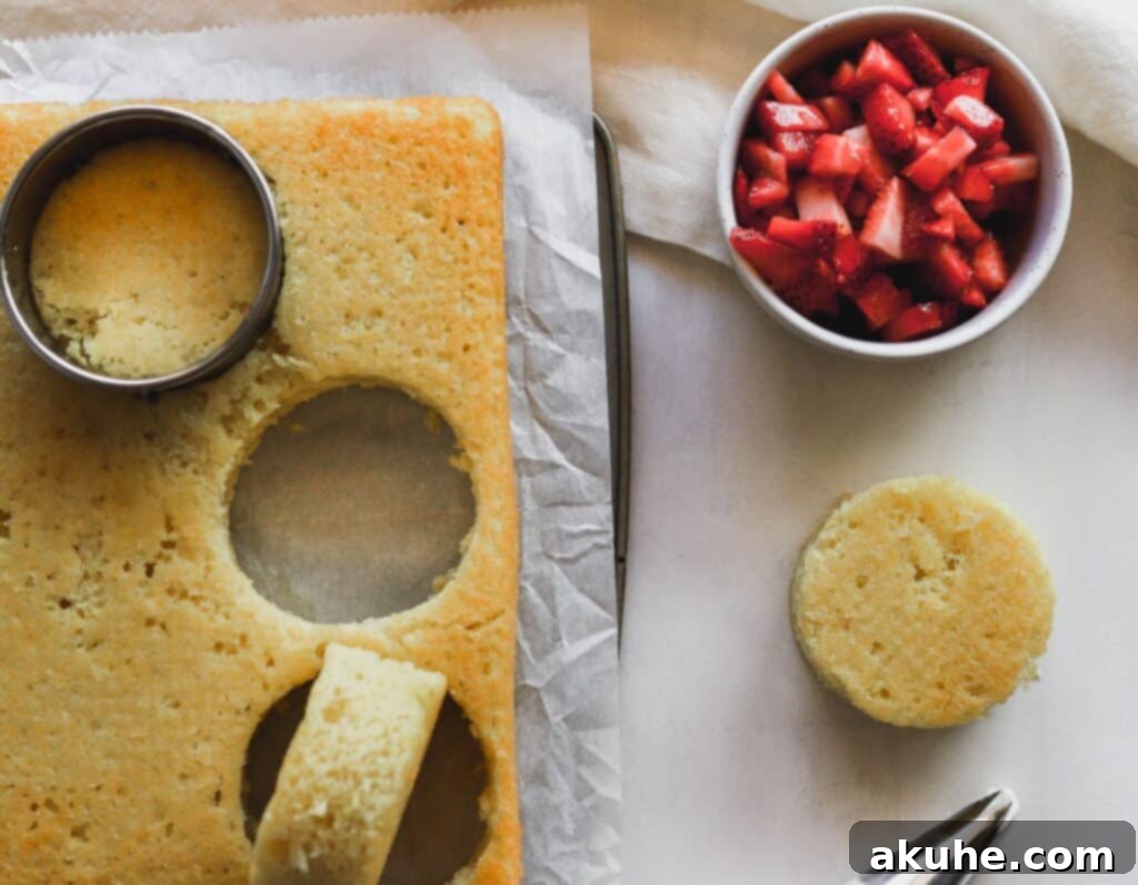 Effortless Strawberry Shortcake Delights 6 Close-up of easy strawberry shortcake trifles, showing distinct layers of cake, strawberries, and whipped cream cheese.