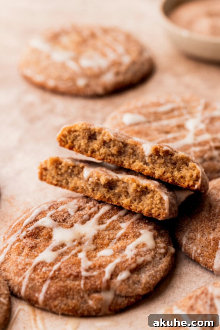 A side view of a split apple cider cookie, revealing its moist, chewy interior.