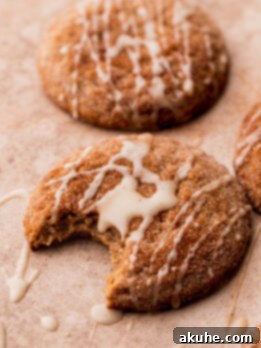 A delicious apple cider cookie with a bite missing, ready to be savored.