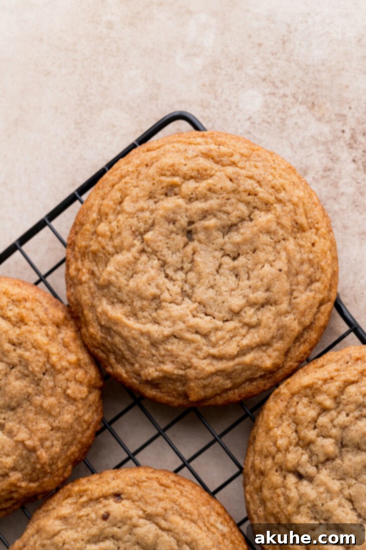 Freshly baked cookies cooling on a wire rack.