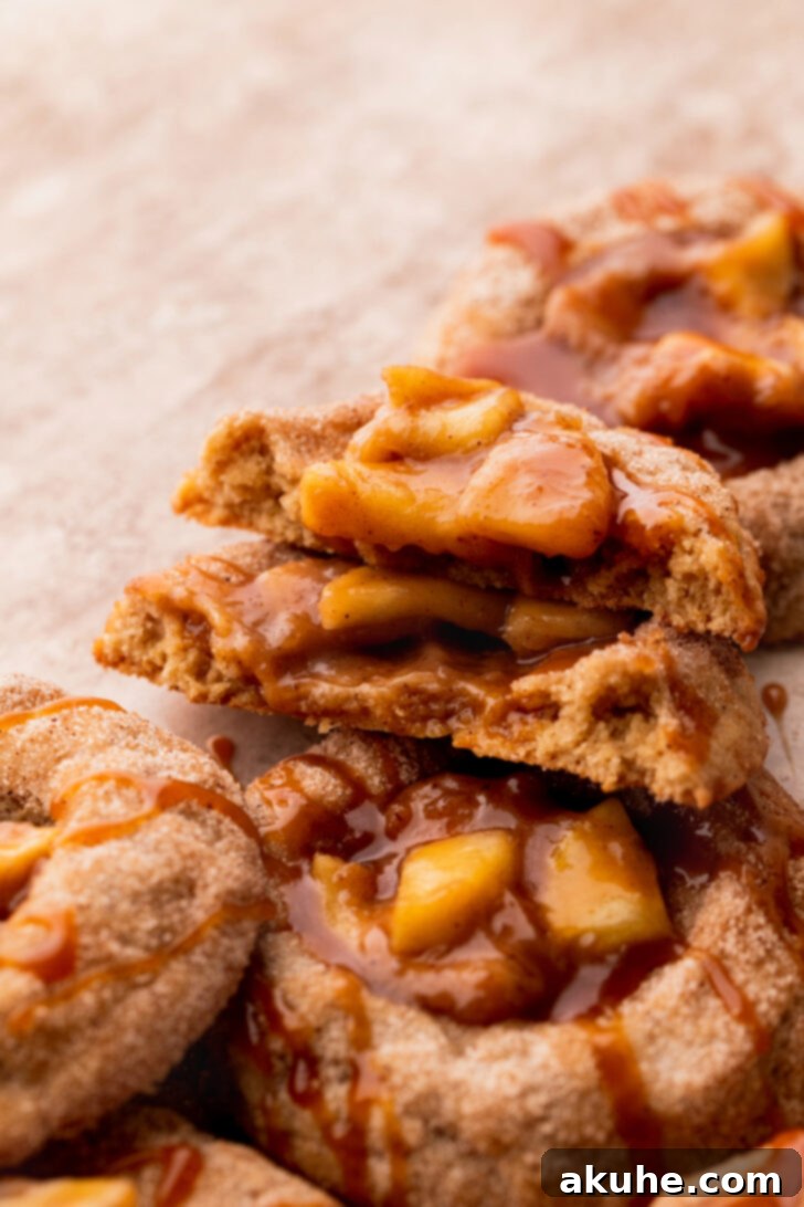 Spiced Apple Pie Cookies 3 A baked apple pie thumbprint cookie with a crisp edge and golden-brown hue.