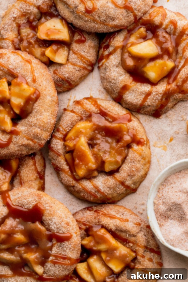 Spiced Apple Pie Cookies 10 Top view of cinnamon-coated thumbprint cookies, ready for filling.