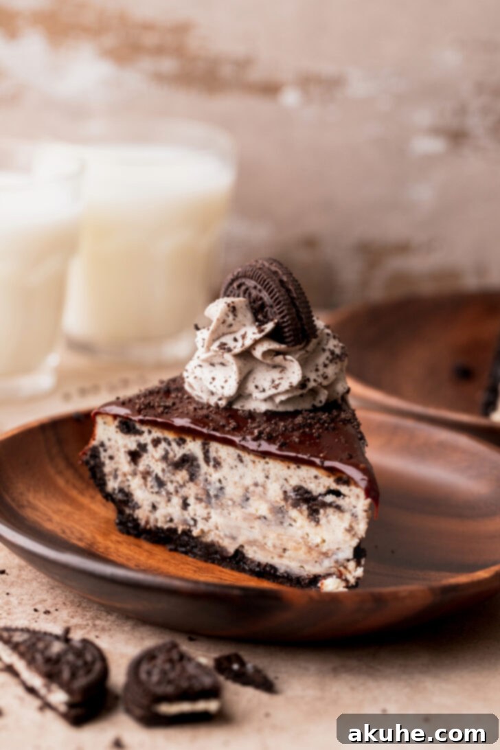 Ultimate Oreo Cheesecake 11 One slice of Oreo cheesecake on a plate.