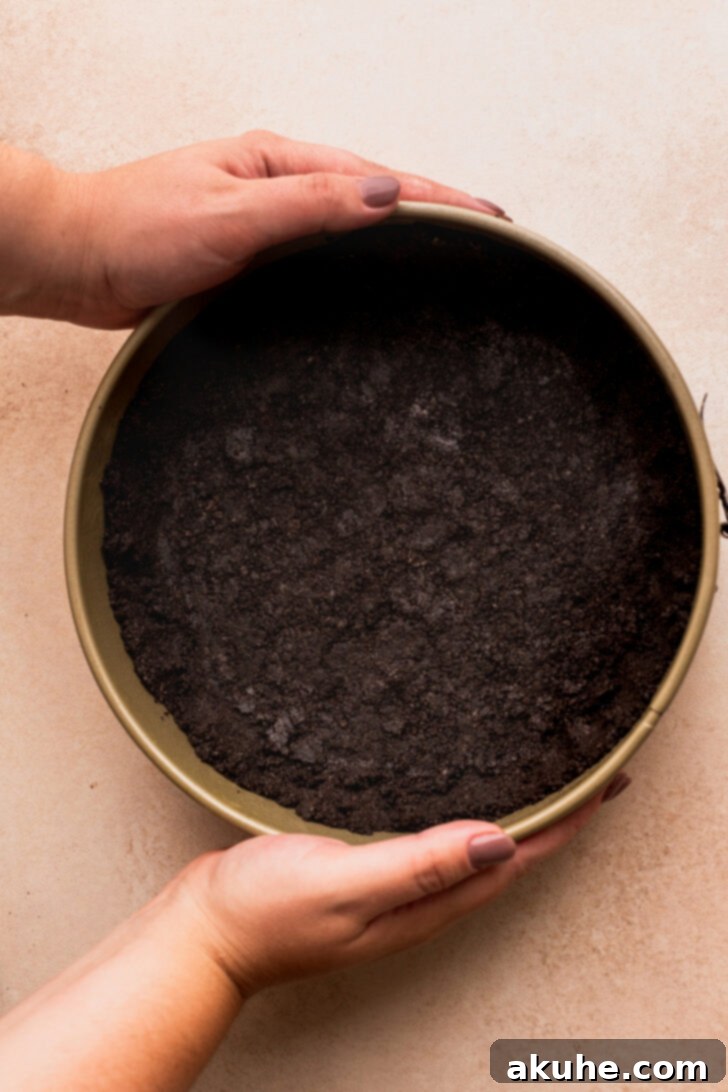 Ultimate Oreo Cheesecake 4 Oreo crust in a pan.