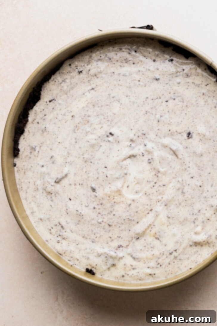 Ultimate Oreo Cheesecake 6 Cheesecake batter in a pan.