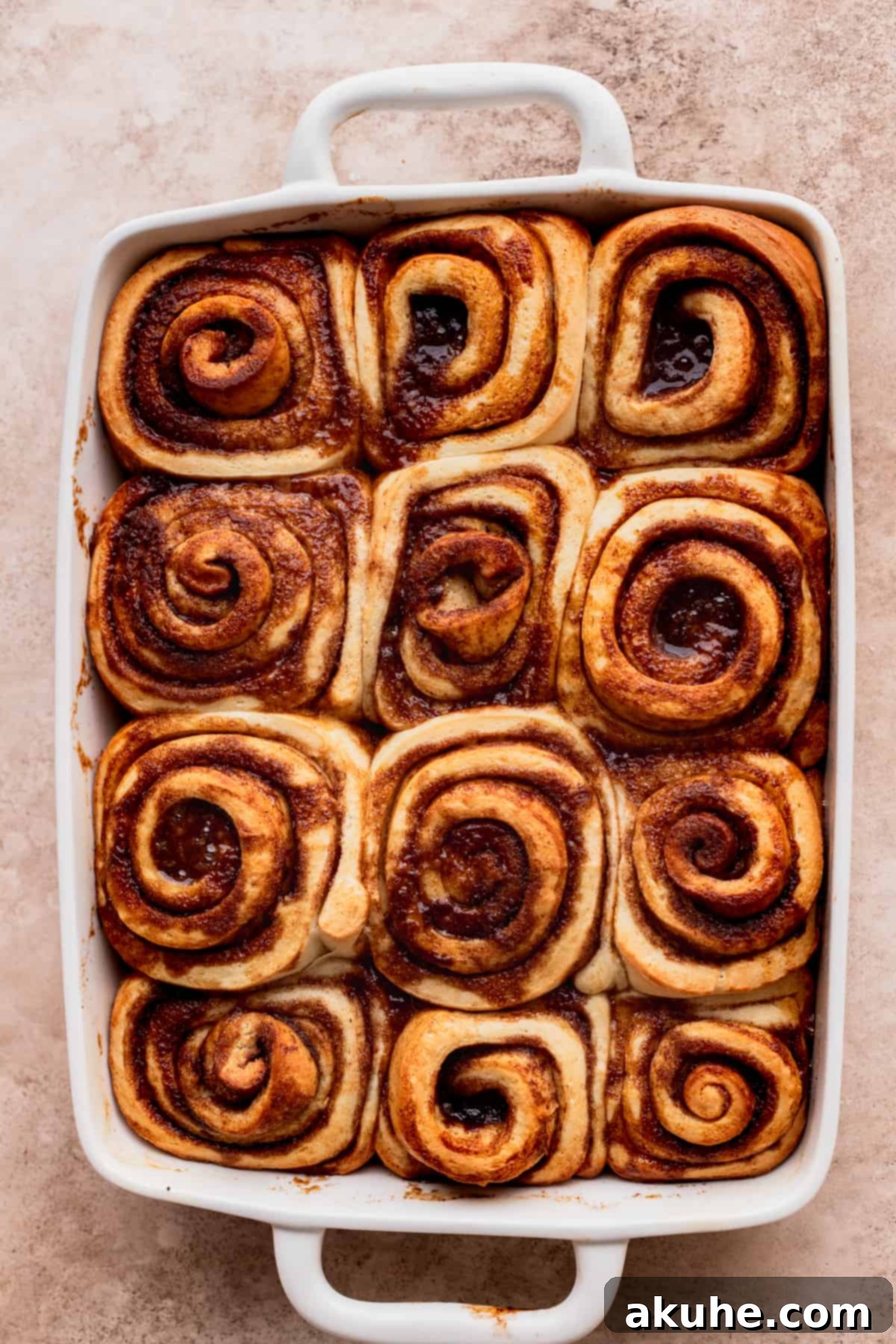 Decadent Caramel Cinnamon Rolls 13 Golden-brown baked cinnamon rolls in the pan, fresh from the oven and ready for icing.