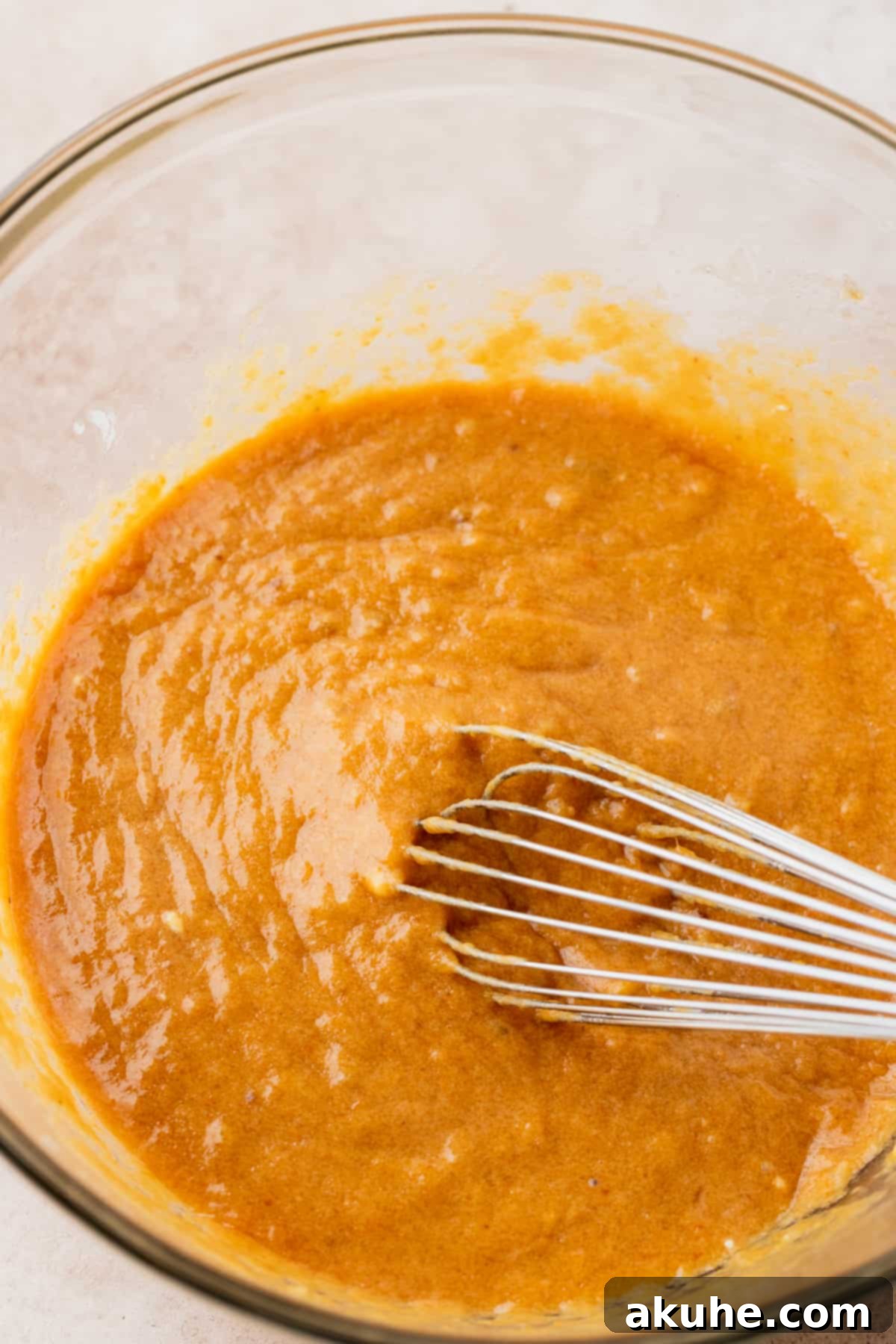 Autumn Spiced Banana Pumpkin Muffins 4 Wet ingredients beautifully blended in a mixing bowl.