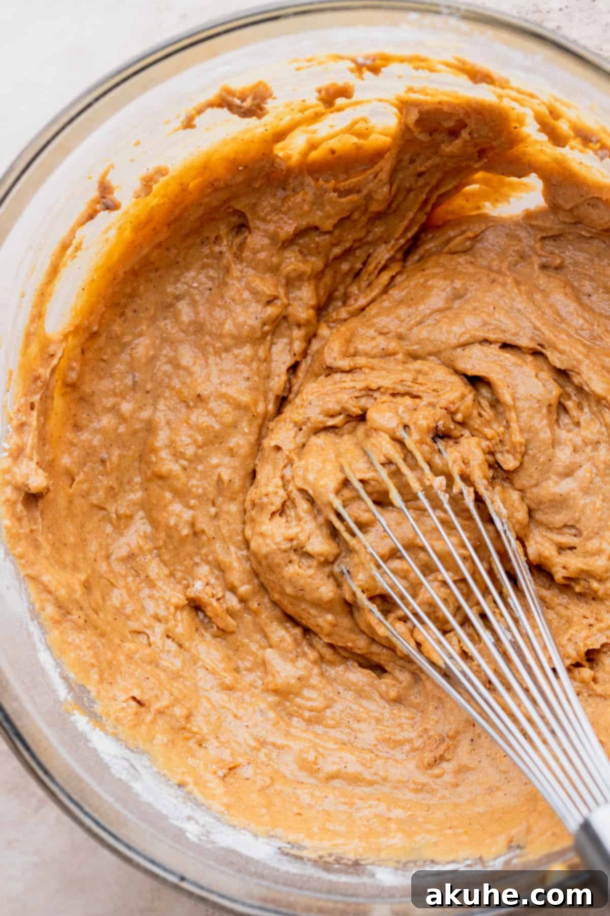 Autumn Spiced Banana Pumpkin Muffins 5 Muffin batter showcasing its perfect consistency in a glass bowl.