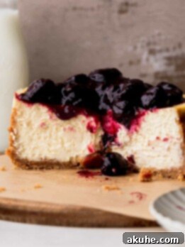 Mini Cheesecakes 15 Small cheesecake cut in half on a wood board.