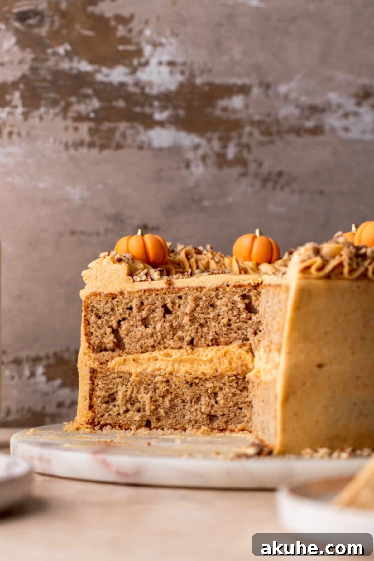 Chai Spiced Cake 9 A slice of chai cake, showing the moist layers and rich frosting, with a fork ready to enjoy.