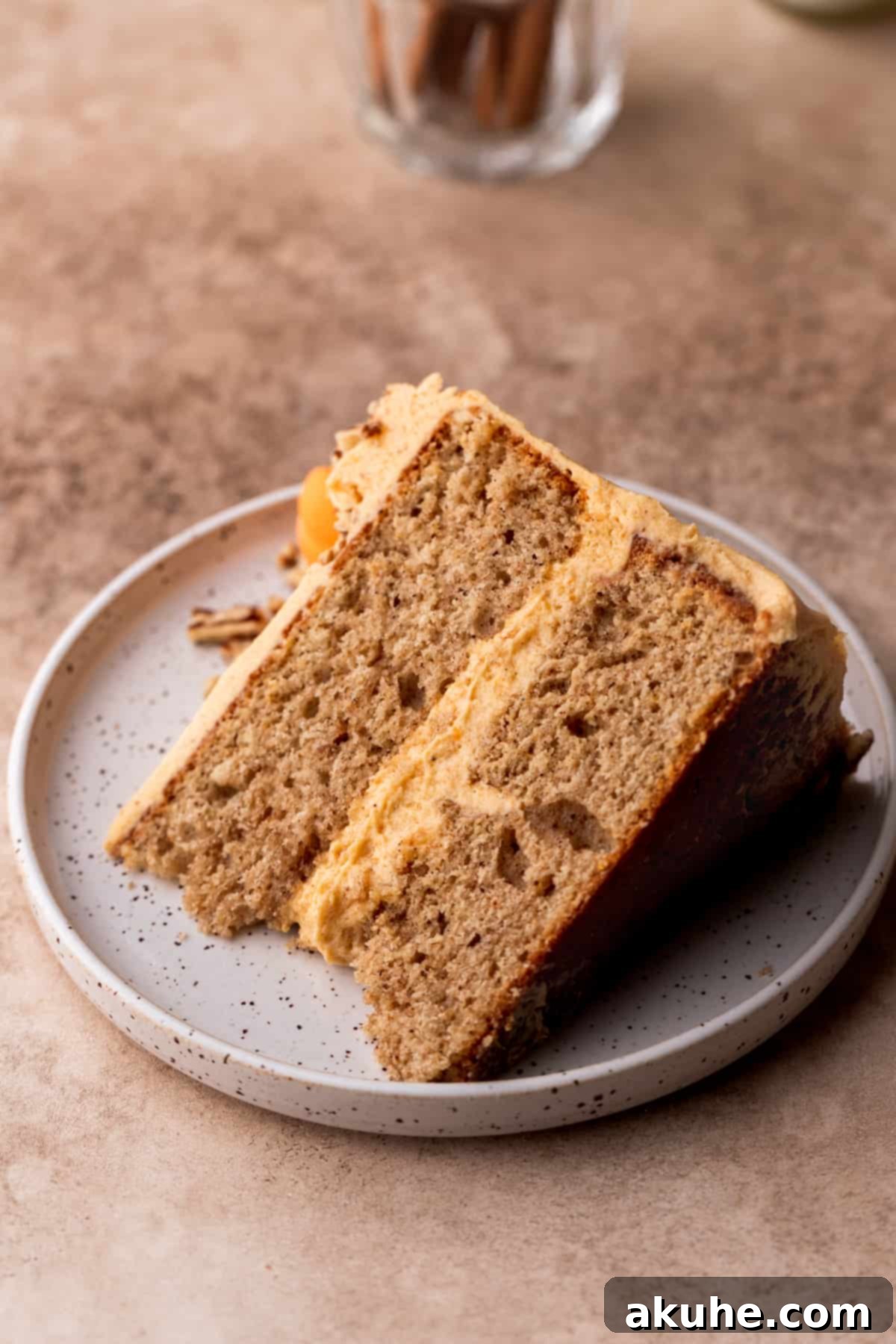 Chai Spiced Cake 10 A perfectly cut slice of chai cake on a small white plate, ready to be eaten.