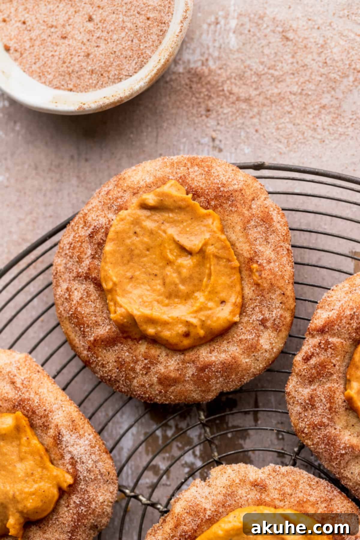 A batch of delicious Pumpkin Pie cookies arranged on a wire rack, ready to be enjoyed.