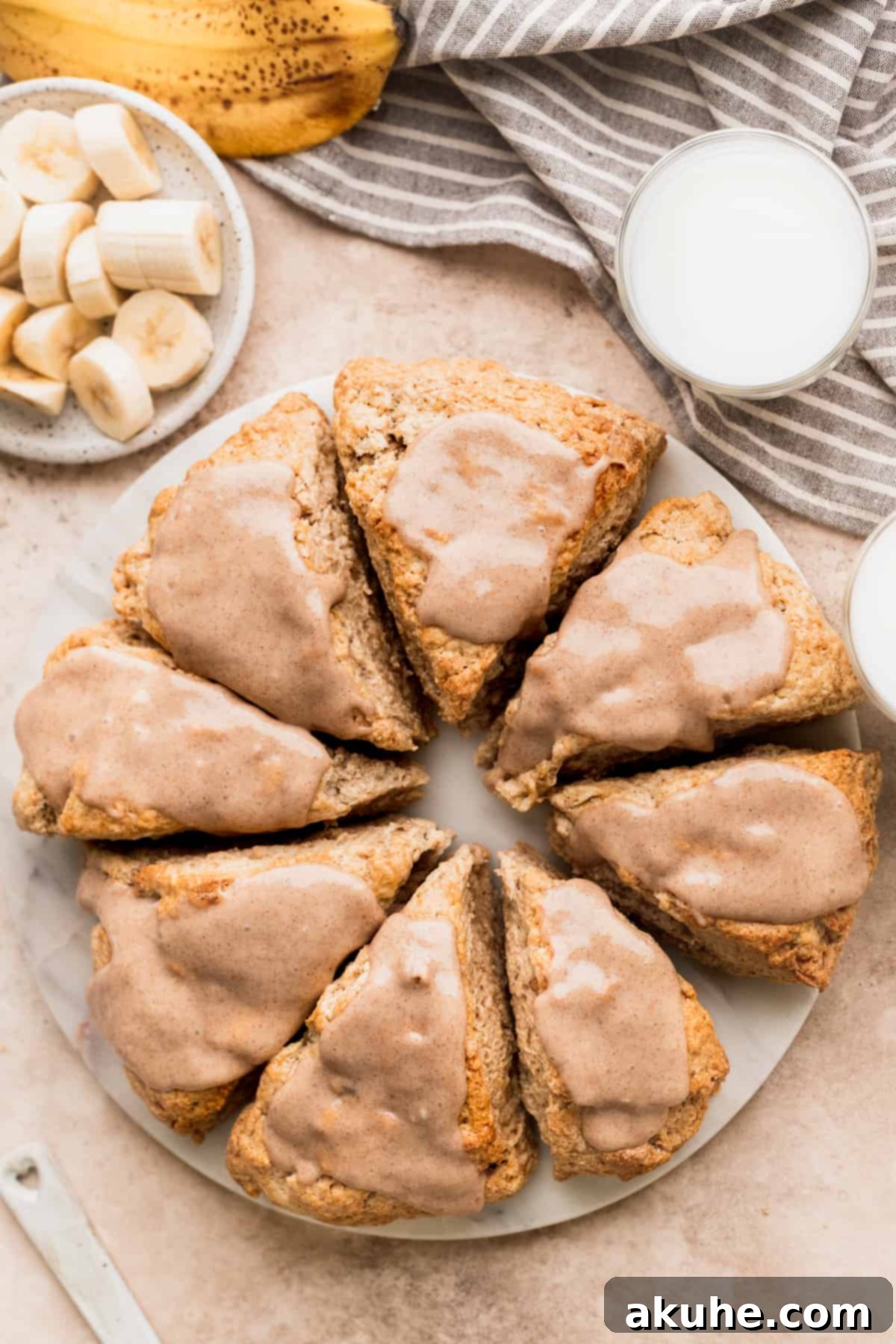 Banana Bread Scones 2 Cinnamon banana scones arranged beautifully on a marble board, ready to be enjoyed.