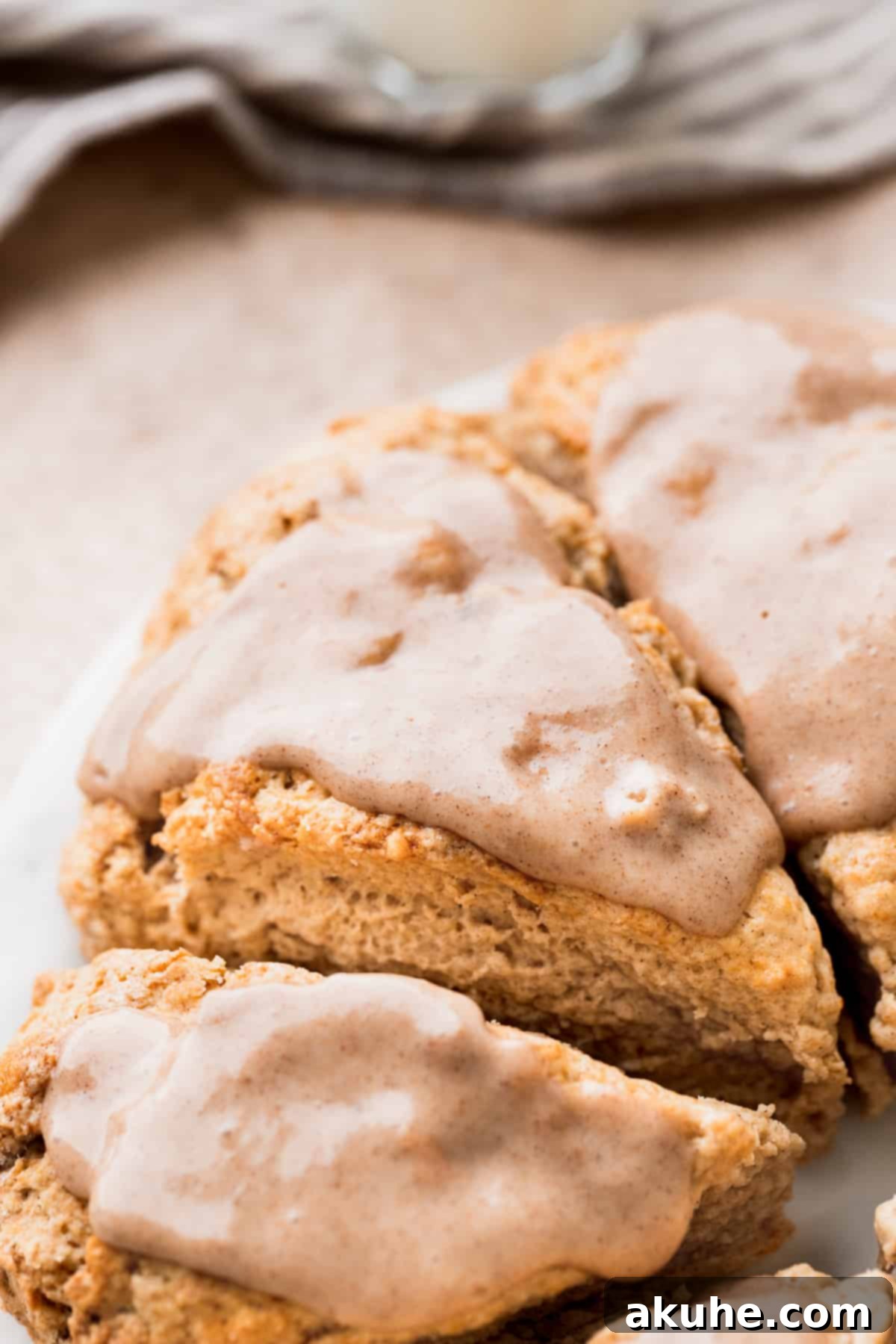 Banana Bread Scones 12 Freshly baked cinnamon banana scones with a generous amount of cream cheese glaze on top.