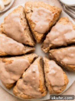Banana Bread Scones 13 Cinnamon banana scones on a marble board.