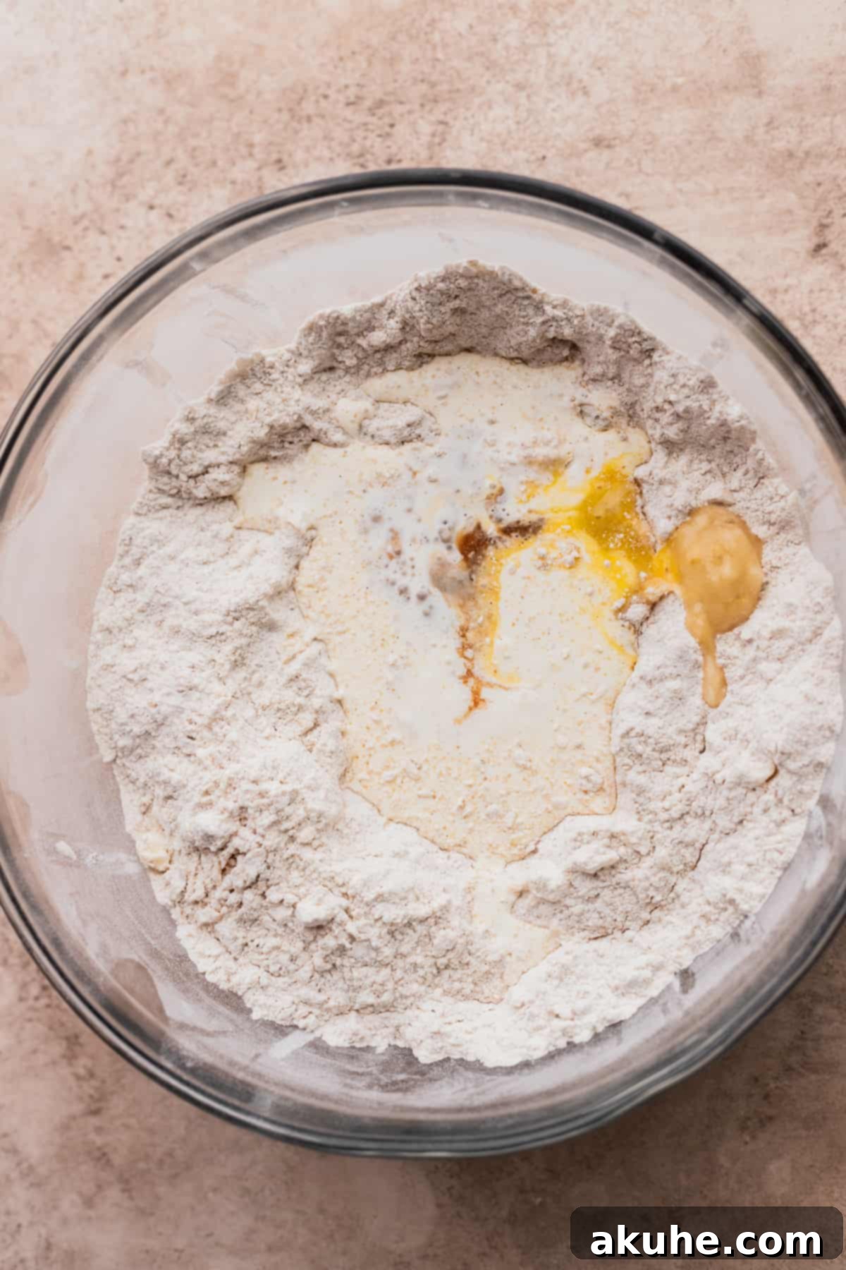 Banana Bread Scones 5 Wet ingredients, including mashed bananas and heavy cream, freshly added to the dry mix.