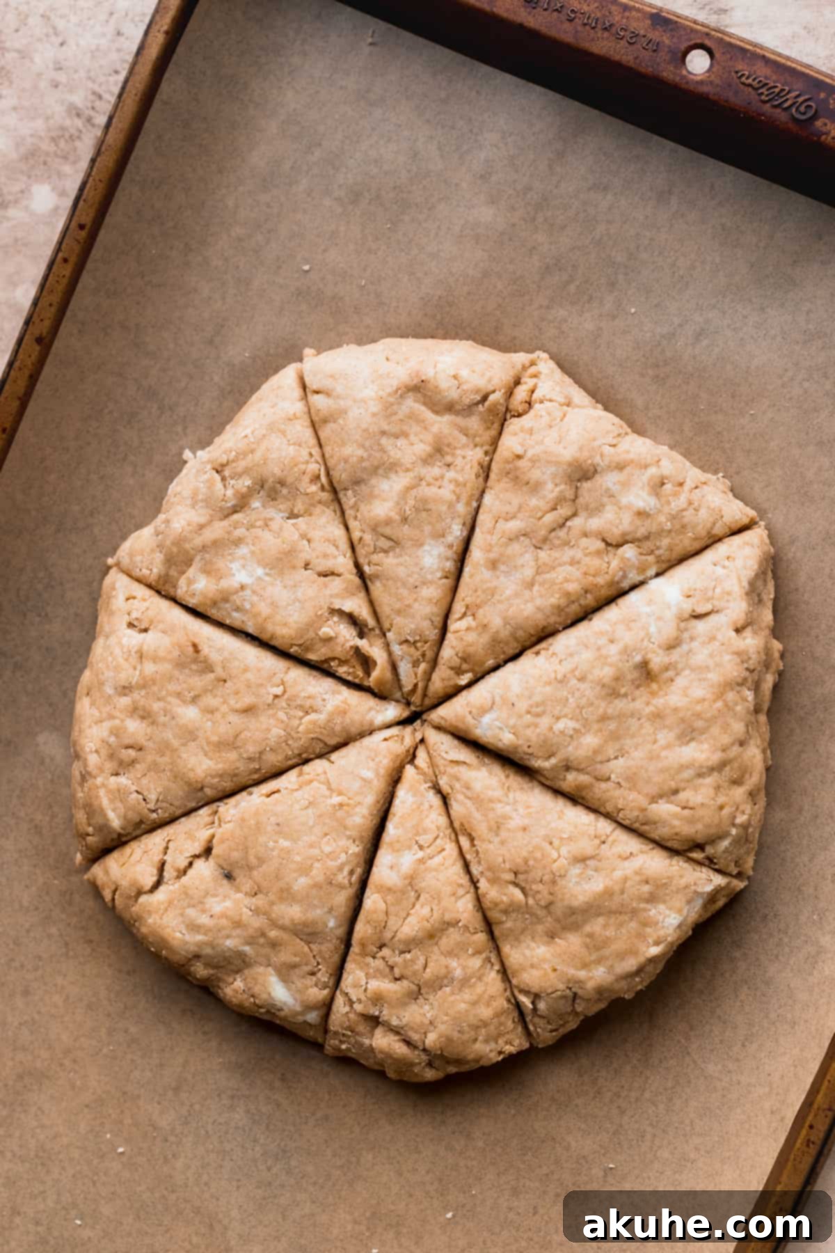 Banana Bread Scones 7 Scone dough pressed into a circle on parchment paper, ready for cutting.