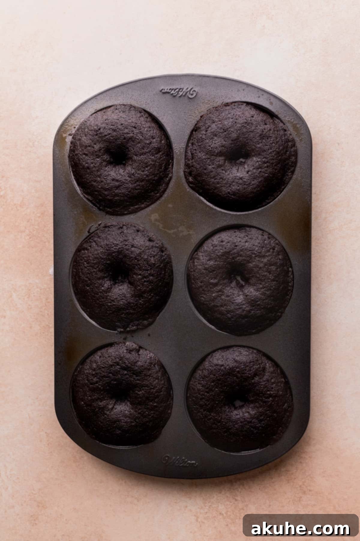 Cookies and Cream Doughnuts 7 Freshly baked donuts in the donut pan, ready to cool.