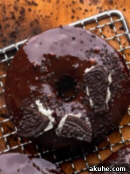 Cookies and Cream Doughnuts 10 Close up of Oreo donuts on a wire rack.