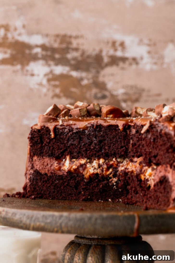 Ultimate Twix Cake 11 Close up of the side of a Twix cake, showing the perfect layers and smooth frosting.