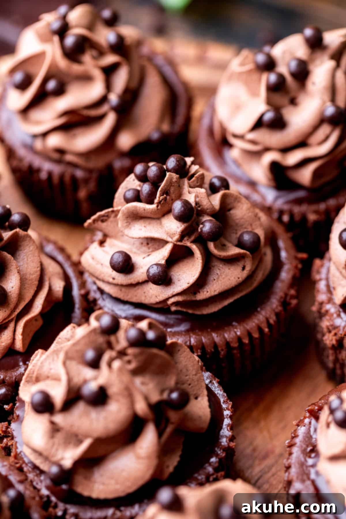 Bite-Sized Chocolate Cheesecakes 11 An inviting side view of a tray of perfectly decorated mini chocolate cheesecakes, ready to be enjoyed.
