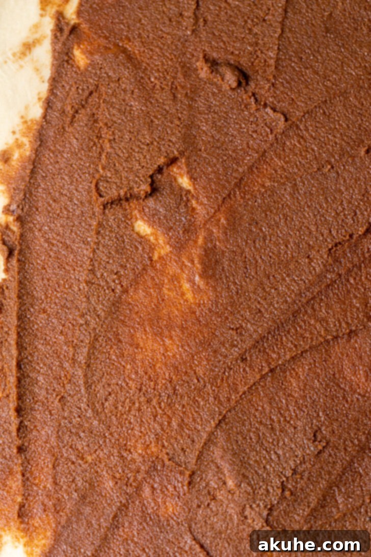 Homemade Apple Cinnamon Rolls 5 A generous layer of cinnamon sugar filling spread evenly over the rolled dough.