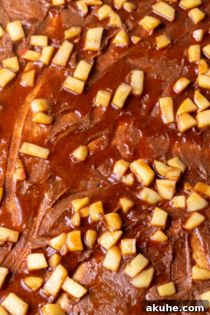 Homemade Apple Cinnamon Rolls 6 A layer of spiced apple pie filling spread over the cinnamon filling on the dough.