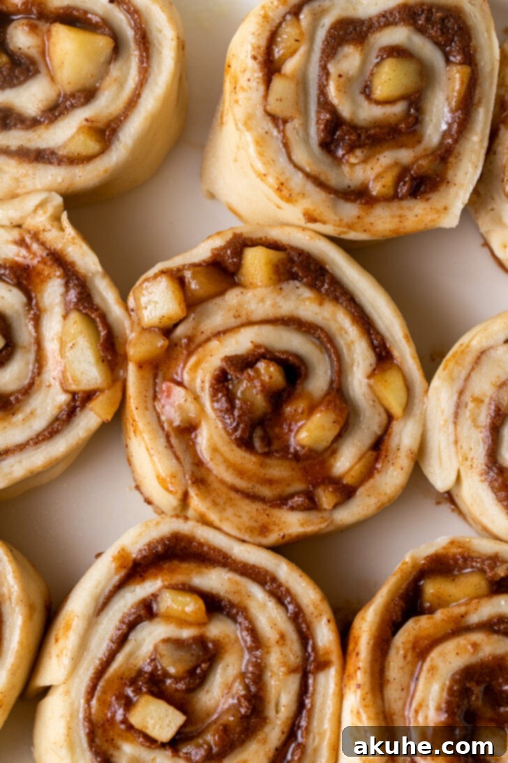 Homemade Apple Cinnamon Rolls 7 Unbaked cinnamon rolls, cut into individual portions and arranged in a baking pan.