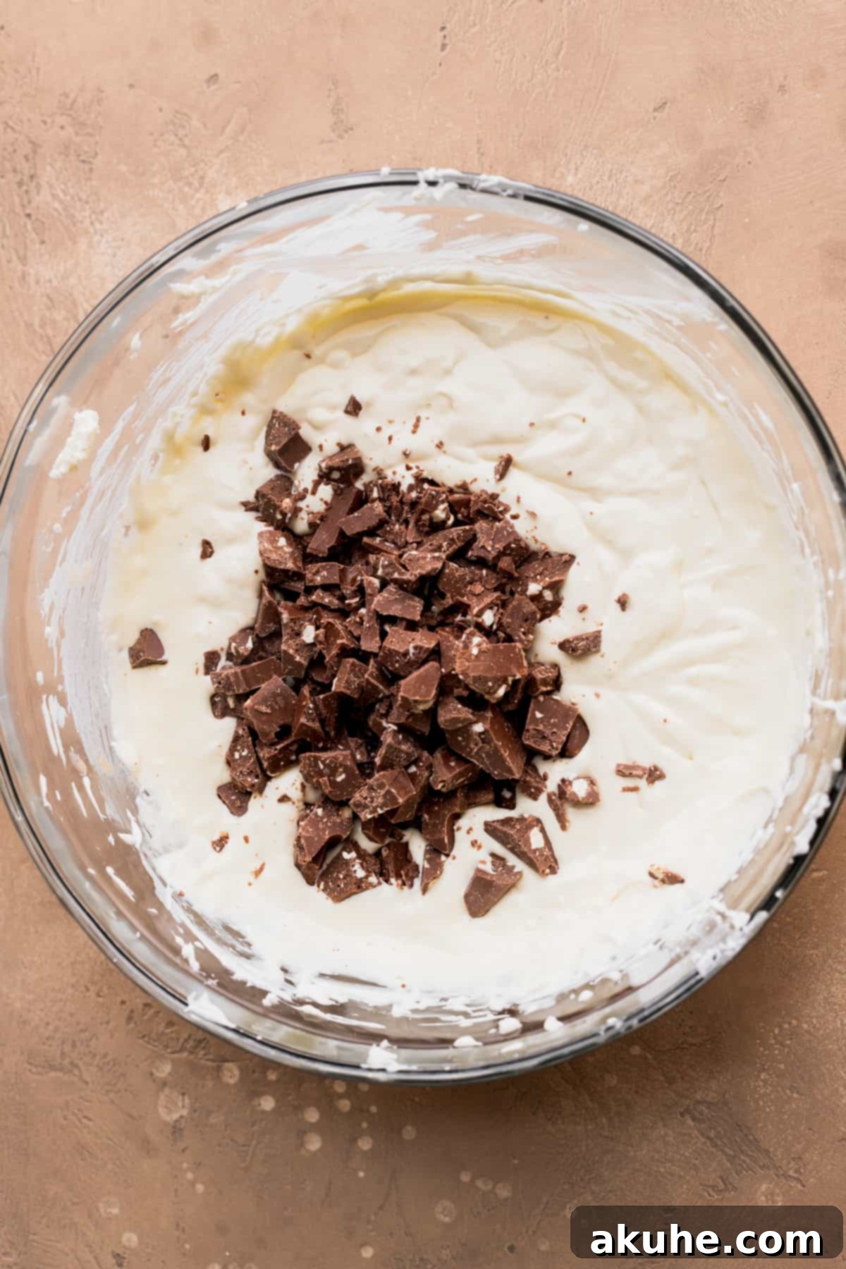 Decadent Toblerone Cheesecake 6 Chopped Toblerone pieces ready to be folded into the cheesecake batter.