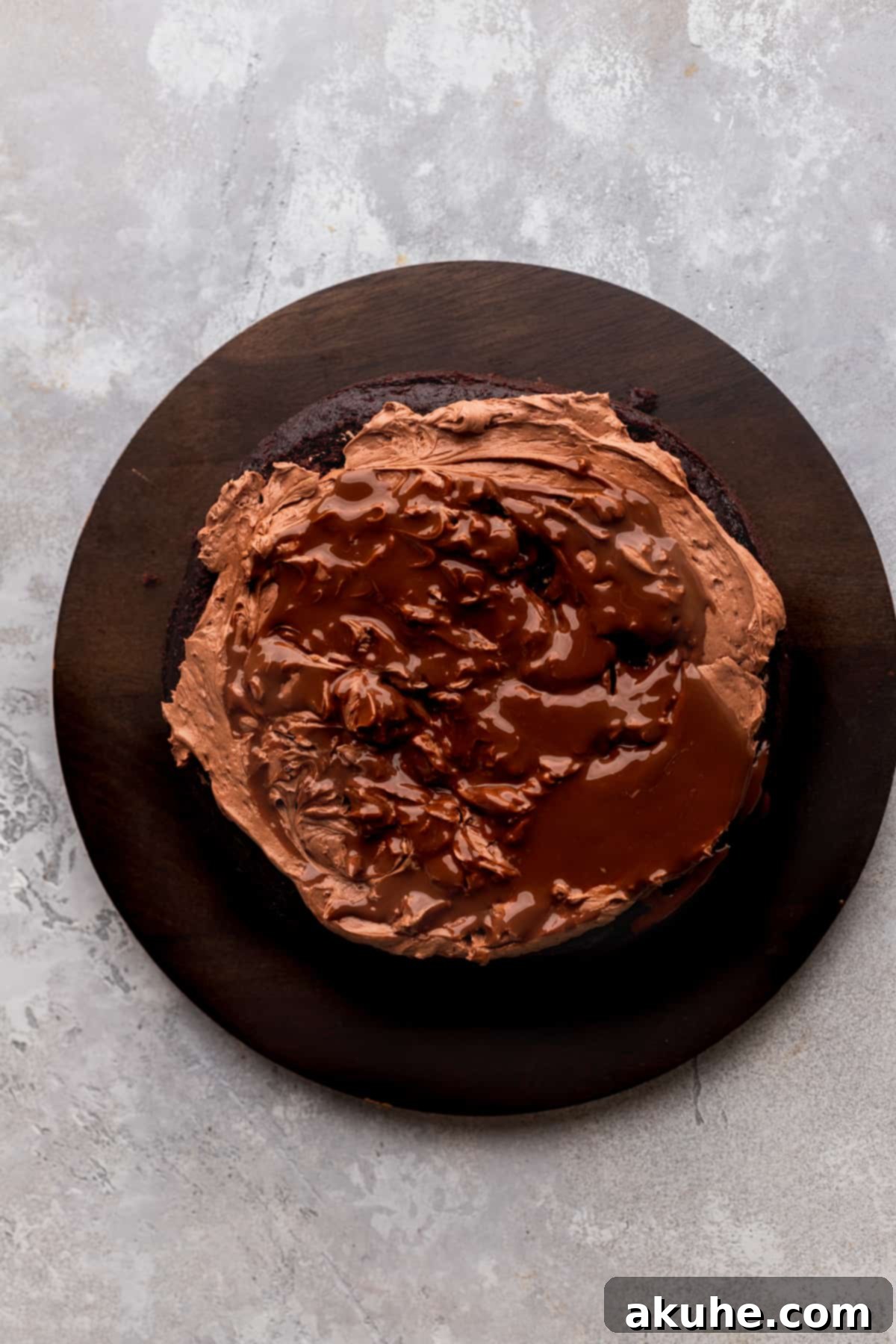 Luscious melted Lindt truffles drizzled and swirled over a frosted cake layer, adding intense chocolate flavor and visual appeal.