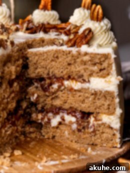 Taking a pecan pie cake slice out of the cake.