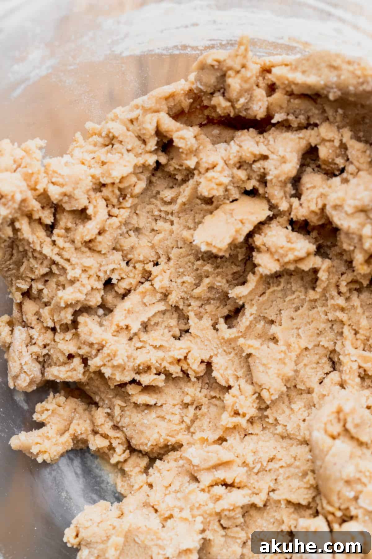 Southern Pecan Pie Cookies 5 Cookie dough in a glass bowl, showcasing its thick and ready-to-bake consistency.