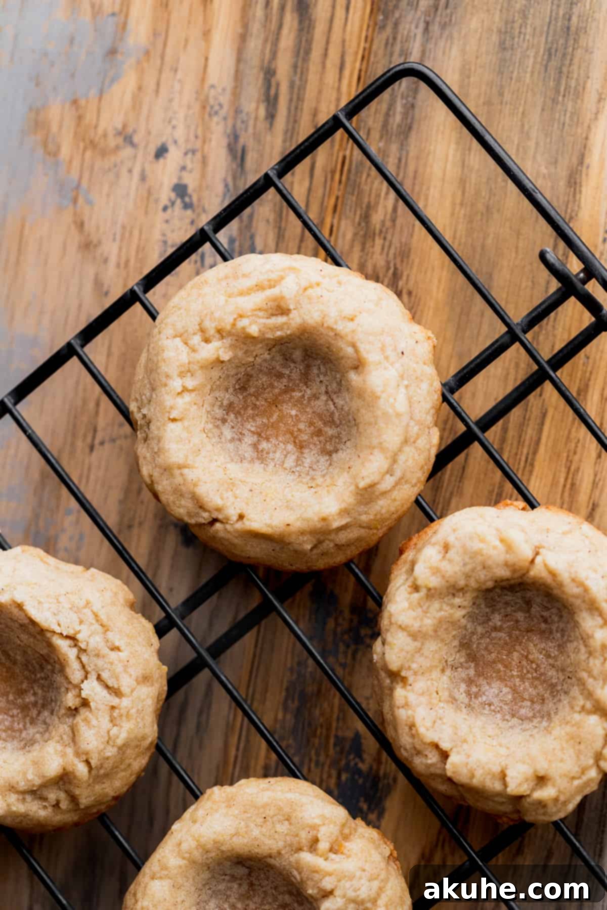 Southern Pecan Pie Cookies 9 Baked cookies on a wire rack, perfectly golden and ready for the next steps.