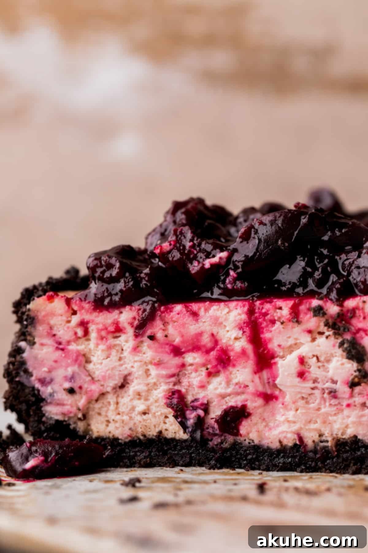 Decadent Cherry Cheesecake 2 Close up of cherry cheesecake cut in half.