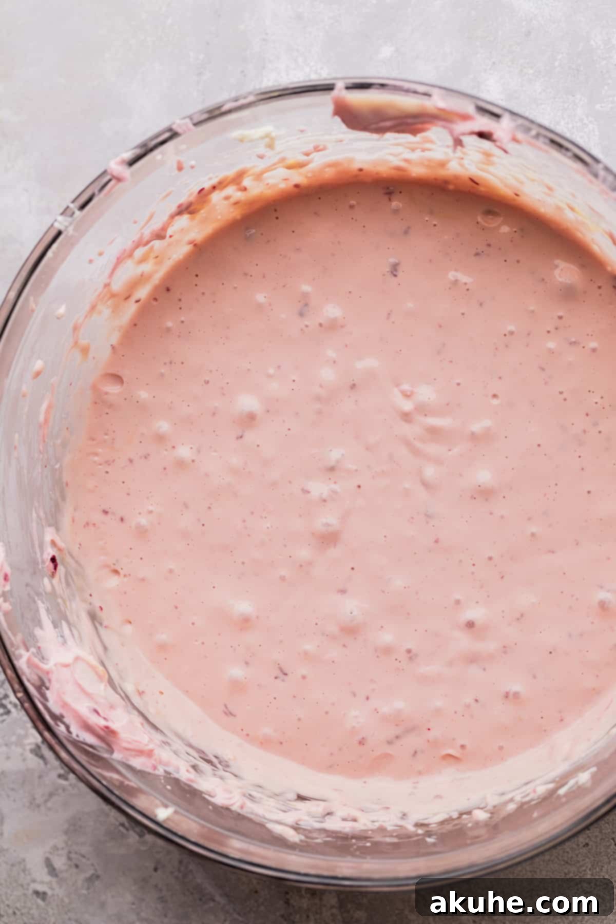 Decadent Cherry Cheesecake 6 Cherry cheesecake batter in a bowl.