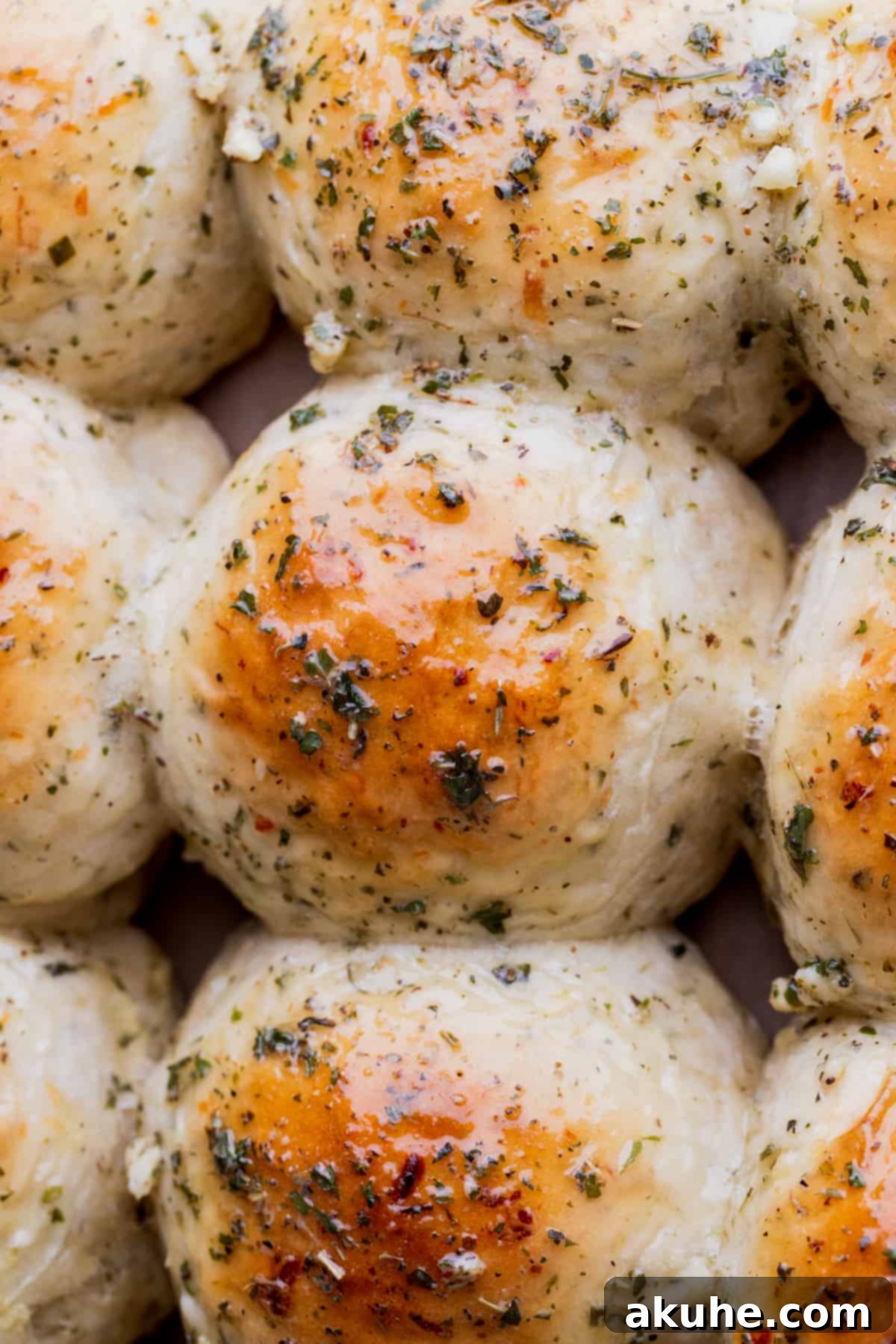 Fresh Baked Garlic Rolls 2 Close-up of golden brown garlic rolls, perfectly baked.