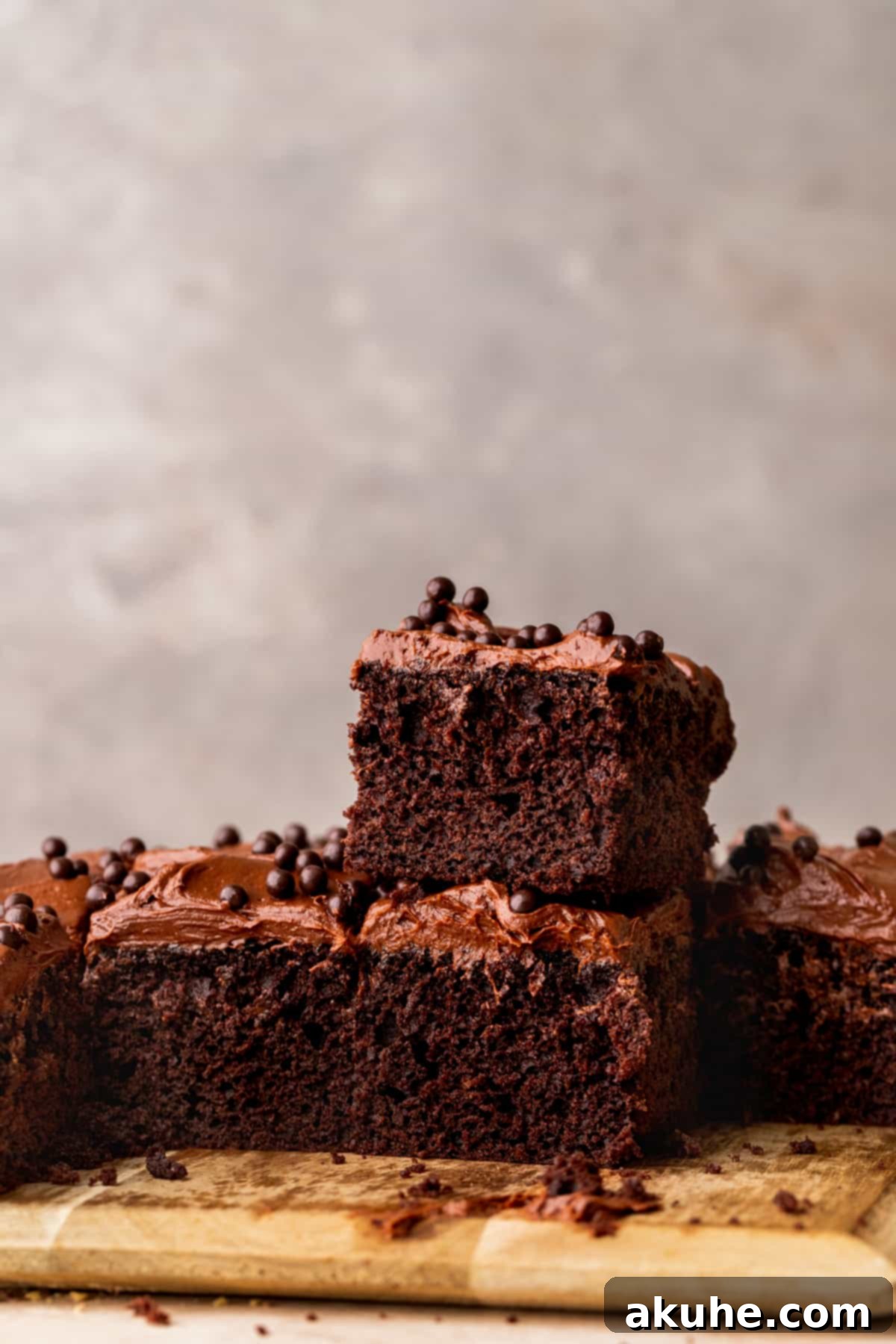 Velvet Chocolate Ganache Torte 2 Stack of two perfectly sliced chocolate ganache cake pieces, showcasing the moist cake layers and rich frosting.