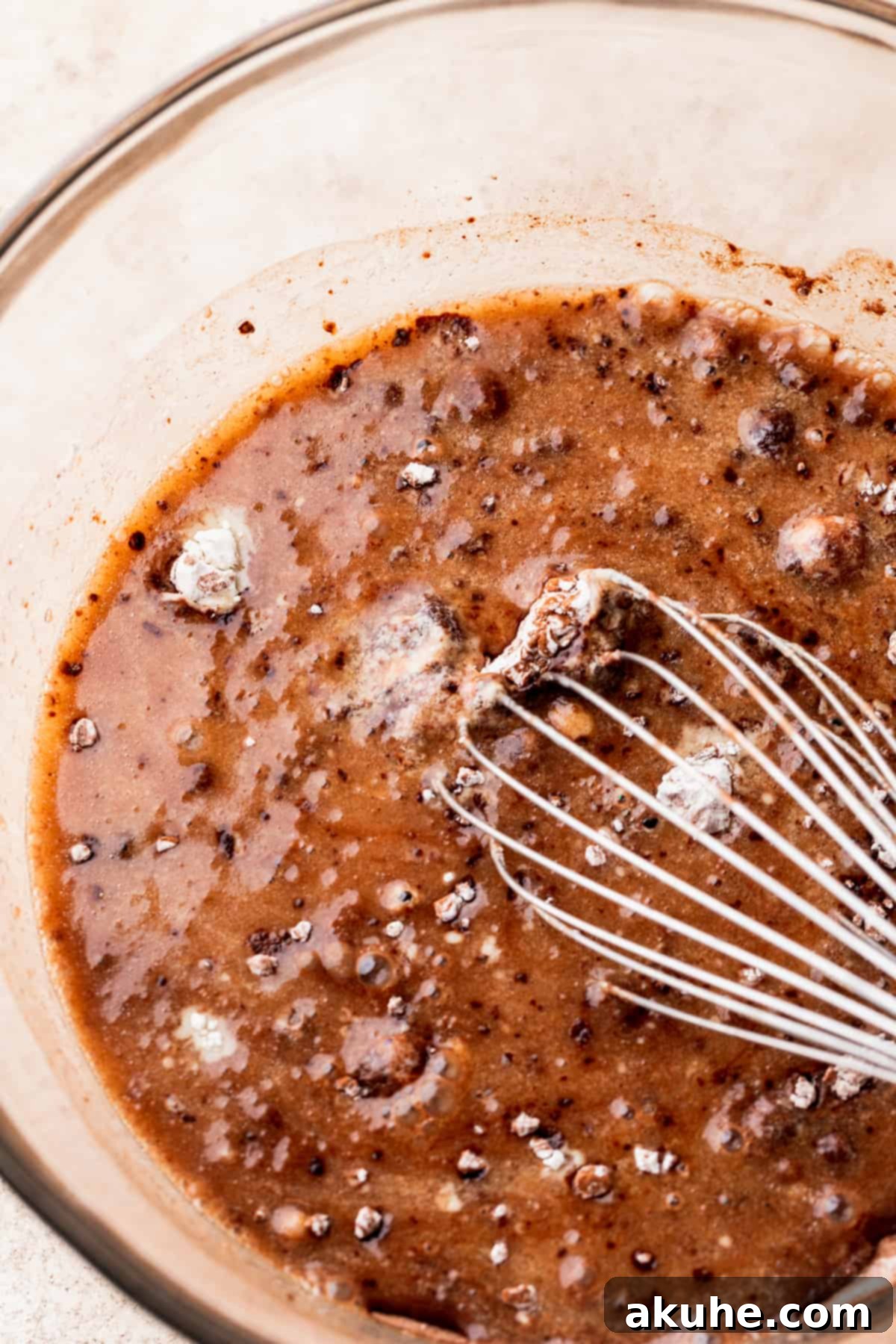 Velvet Chocolate Ganache Torte 4 Wet ingredients beautifully mixed in a clear glass bowl, ready to be combined with dry ingredients.
