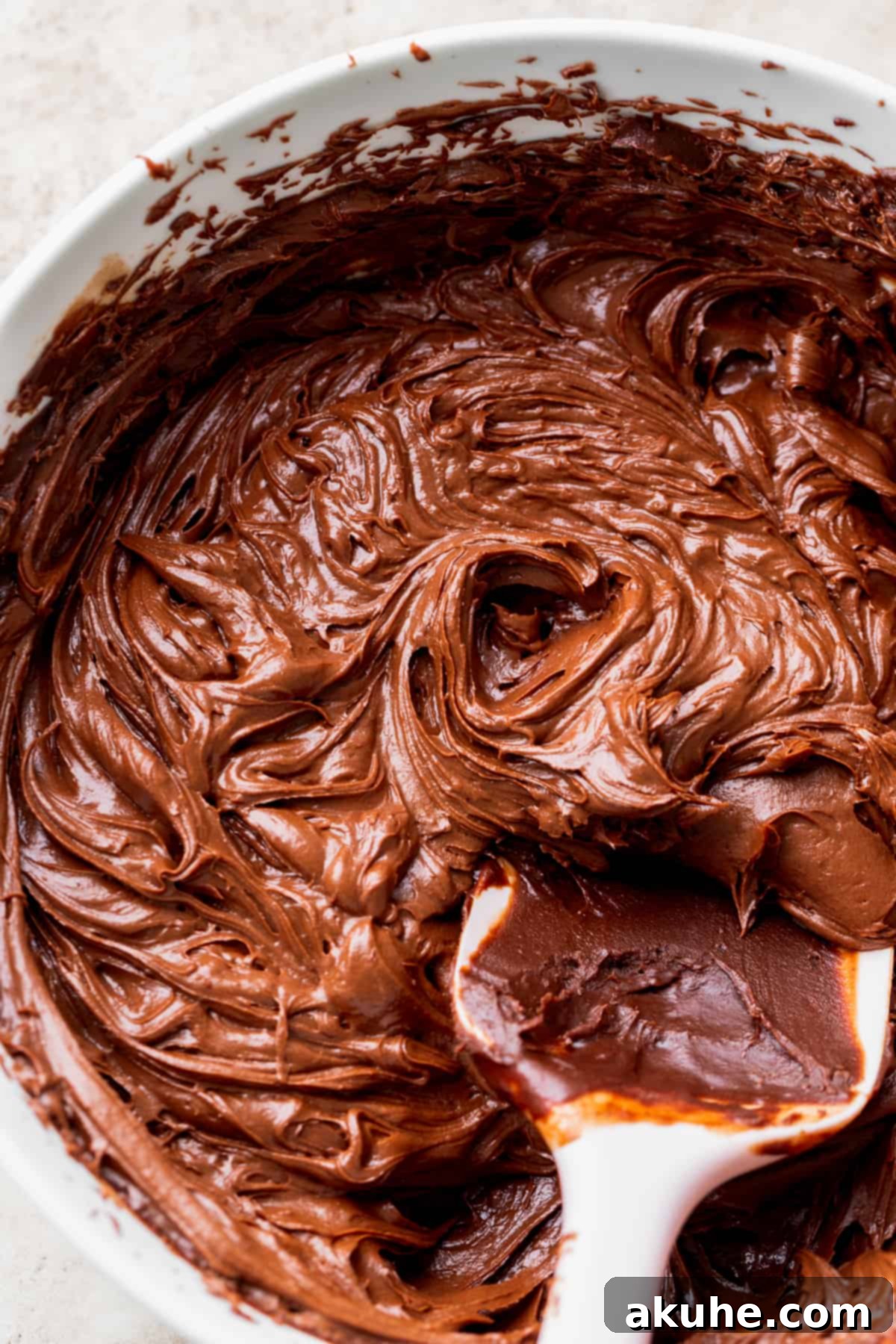 Velvet Chocolate Ganache Torte 7 Luxurious whipped chocolate ganache frosting displayed in a glass bowl, ready to be spread onto the cake.