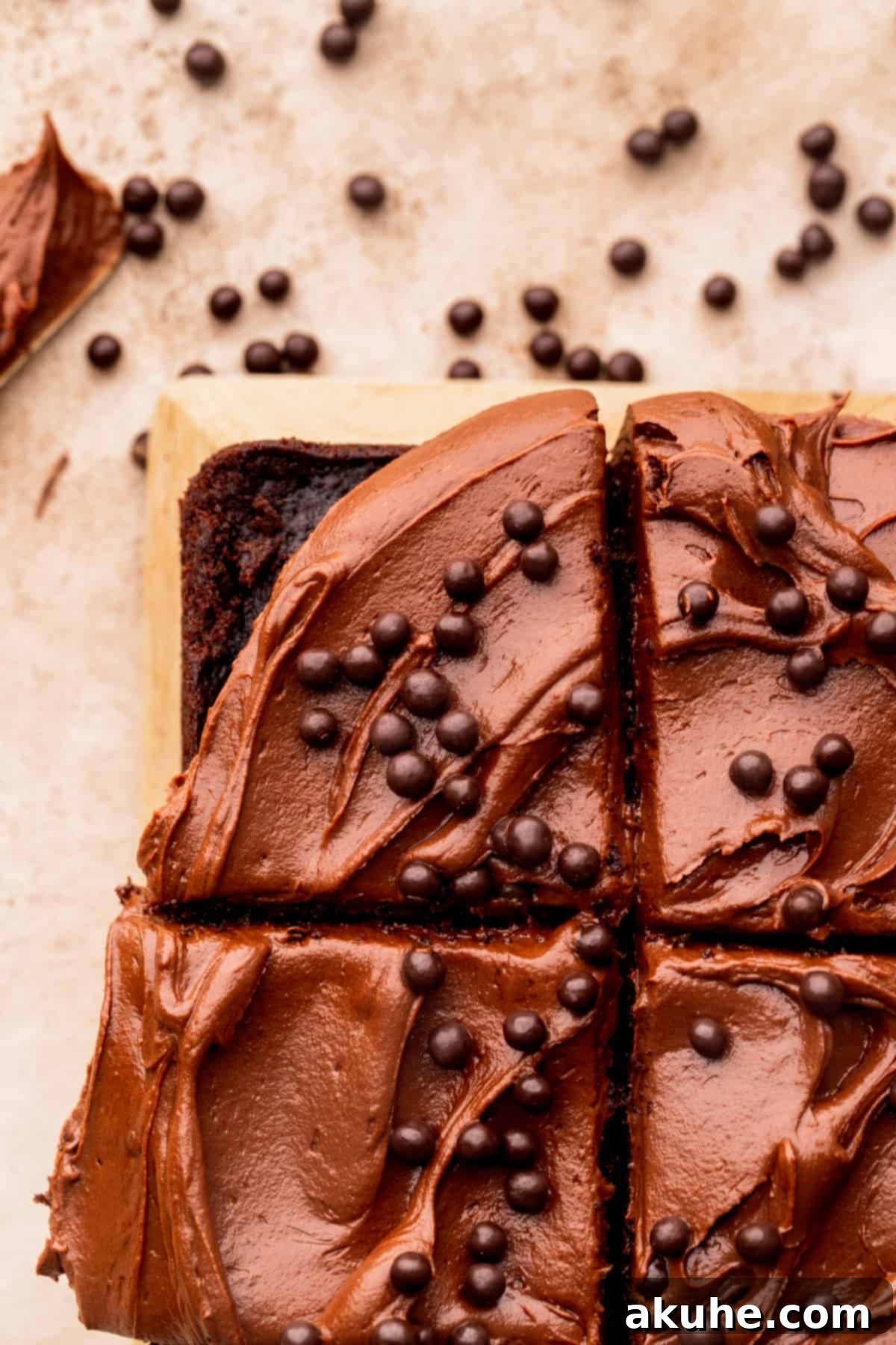 Velvet Chocolate Ganache Torte 8 An overhead view of a perfectly frosted chocolate ganache cake, showcasing its smooth, rich topping.