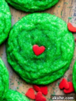 Grinch cookies with heart sprinkles.