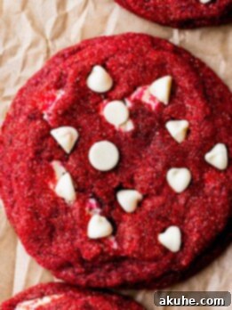 Decadent Red Velvet Cookies 10 Red velvet cookies on a cookie sheet.