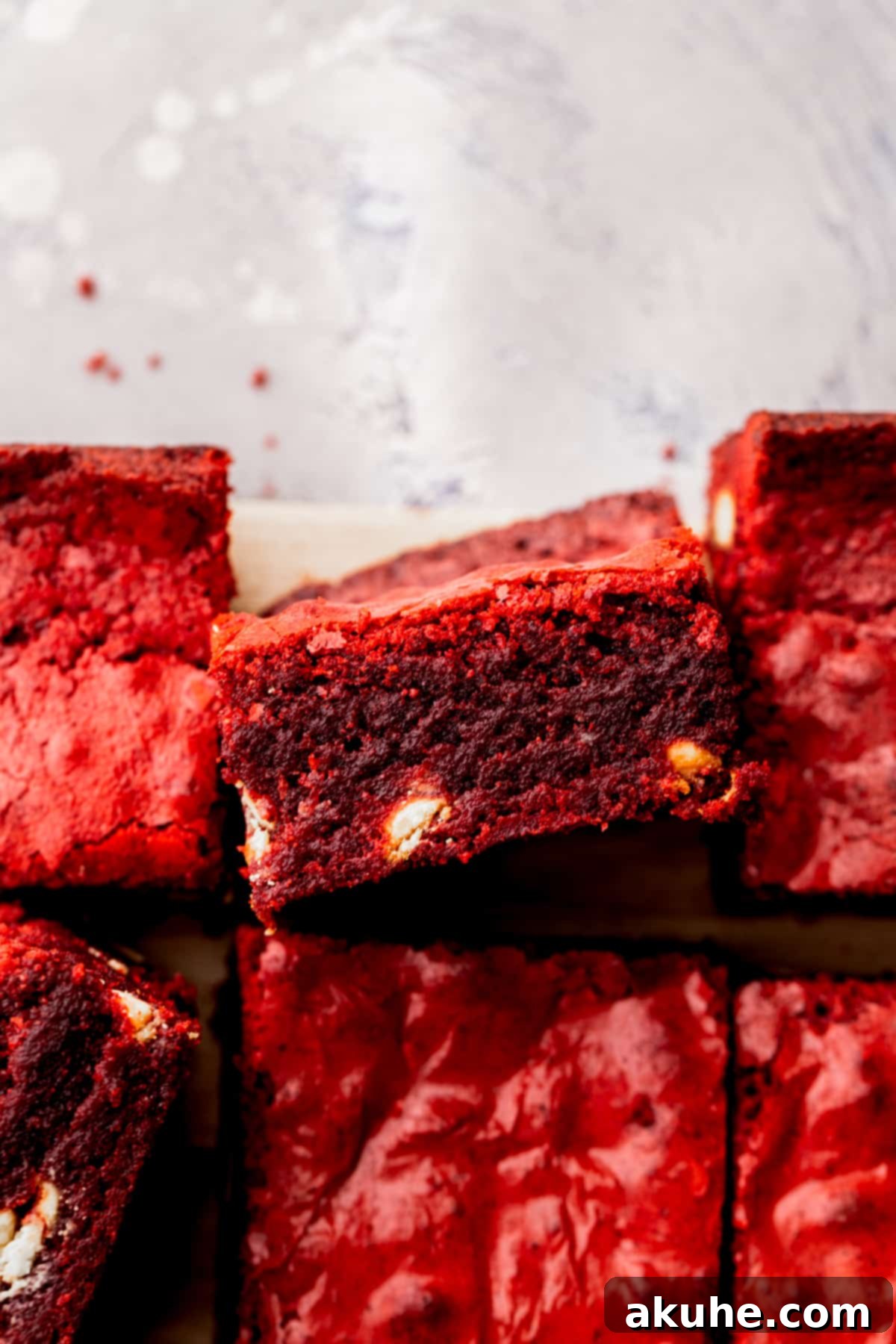 Red velvet brownies with one on its side.