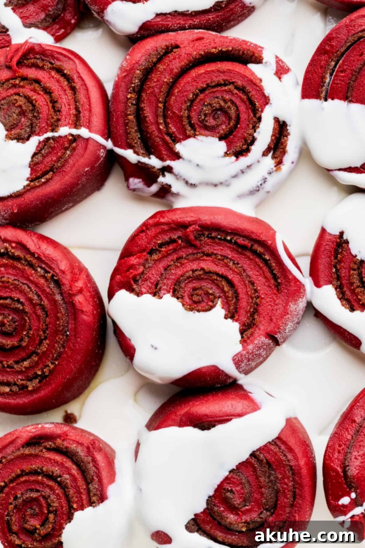 Decadent Red Velvet Cinnamon Rolls 11 Cinnamon rolls in pan with heavy cream on top.