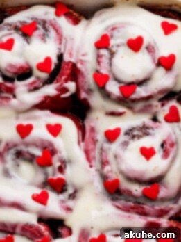 Decadent Red Velvet Cinnamon Rolls 15 Red hearts on top of red velvet cinnamon rolls.