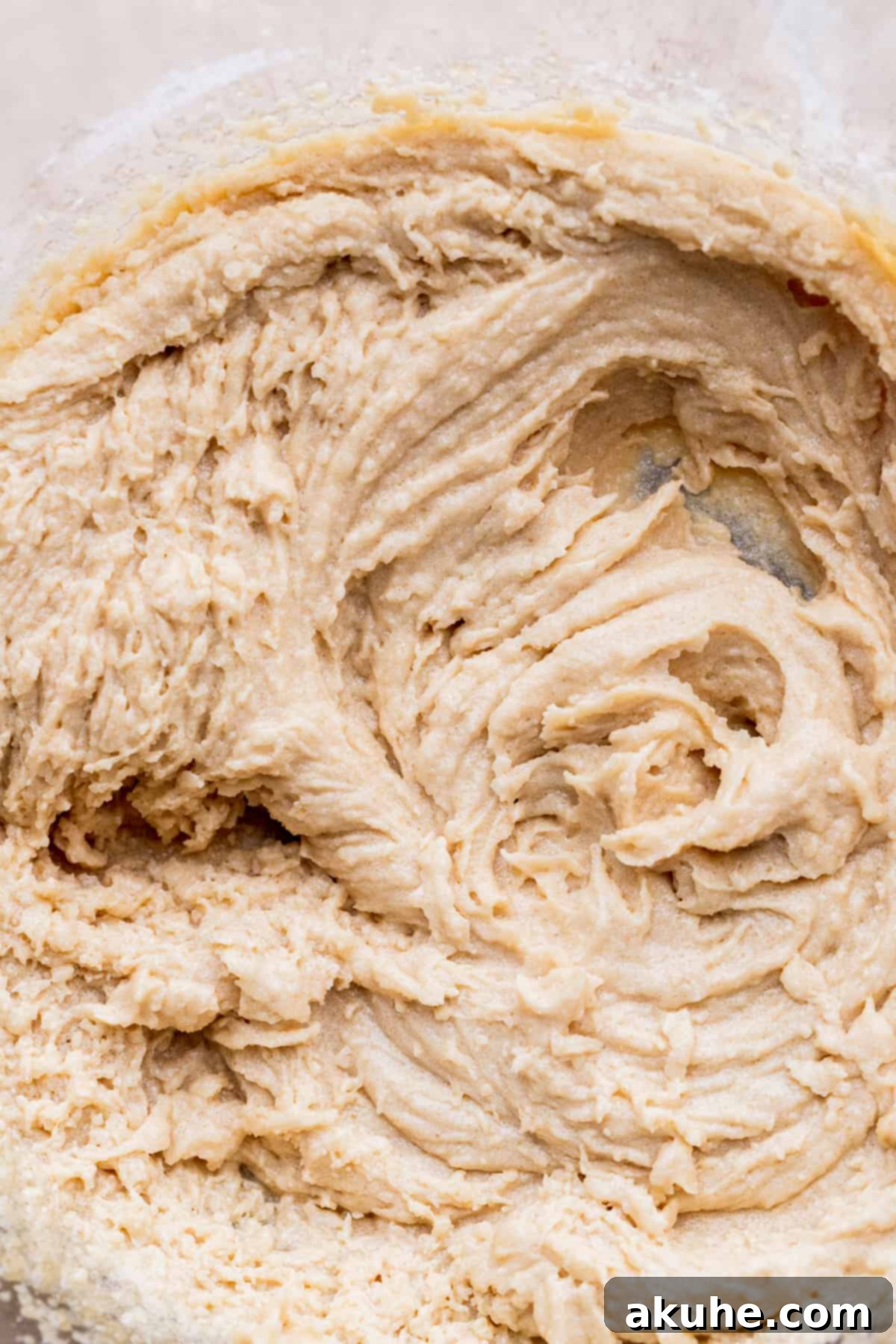 Irresistible Eggless Chocolate Chip Cookies 4 Whipped butter and sugar mixture in a bowl, showing its pale color and creamy texture.