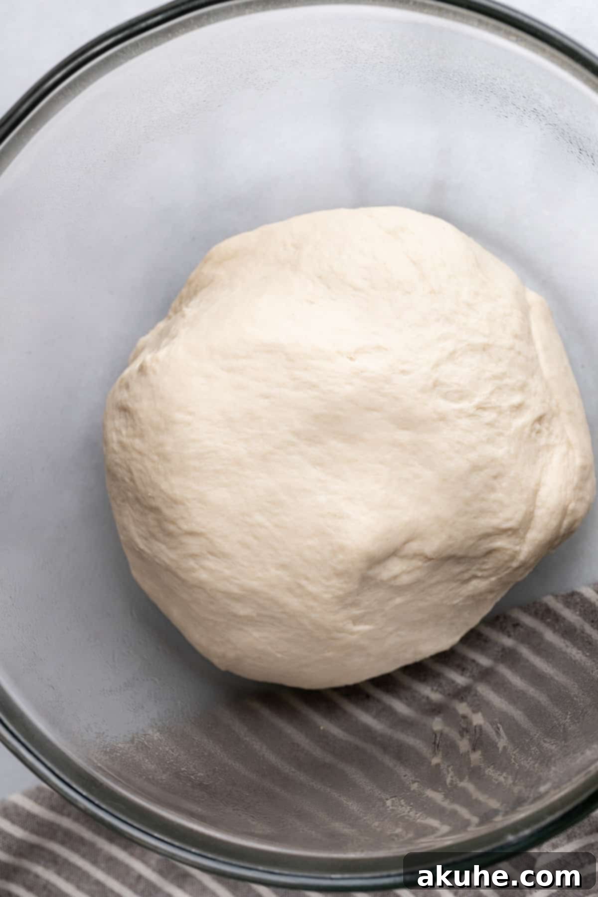 Perfectly Poppable Pretzels 4 Freshly kneaded dough in a glass bowl.