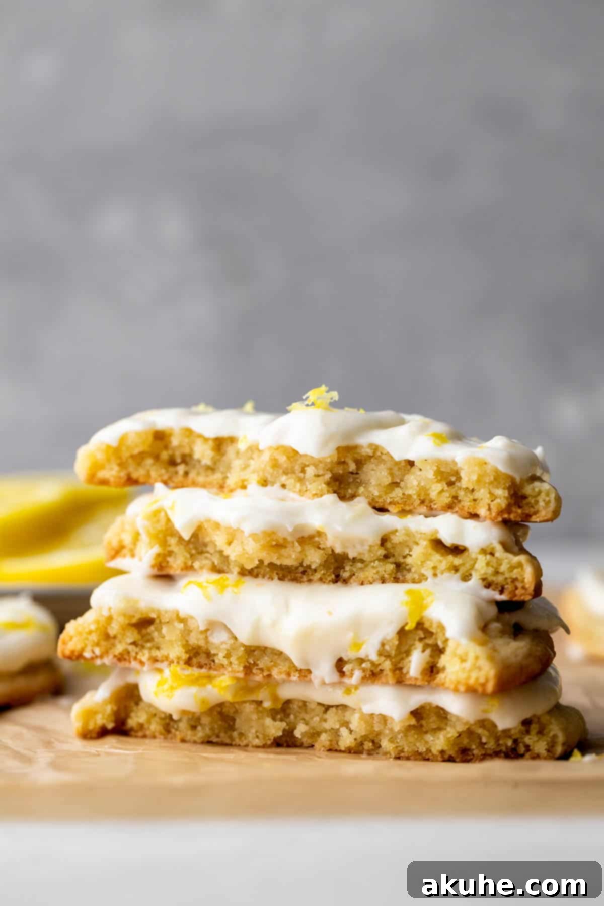Zesty Lemon Bites 2 Stack of 2 lemon cookies split in half, revealing their chewy interior.