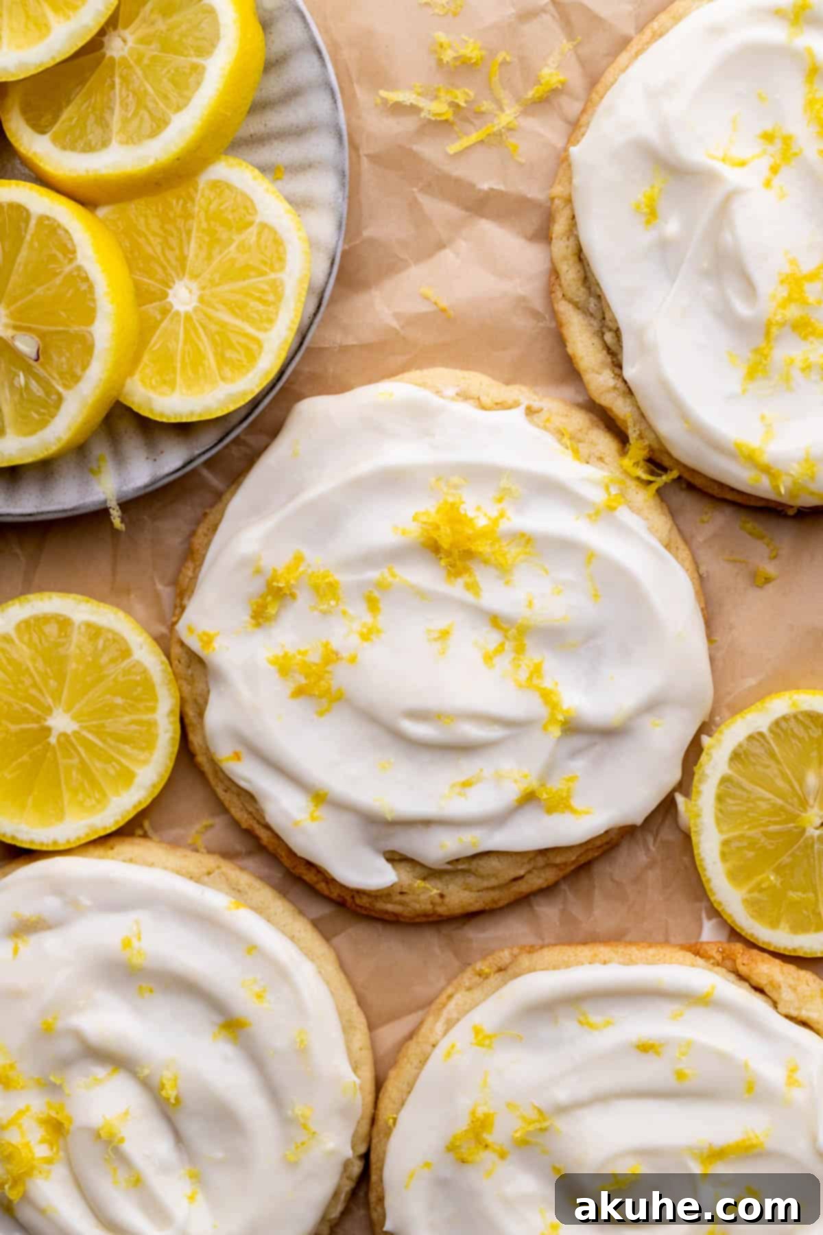 Zesty Lemon Bites 3 Freshly baked lemon cookies arranged neatly on parchment paper.