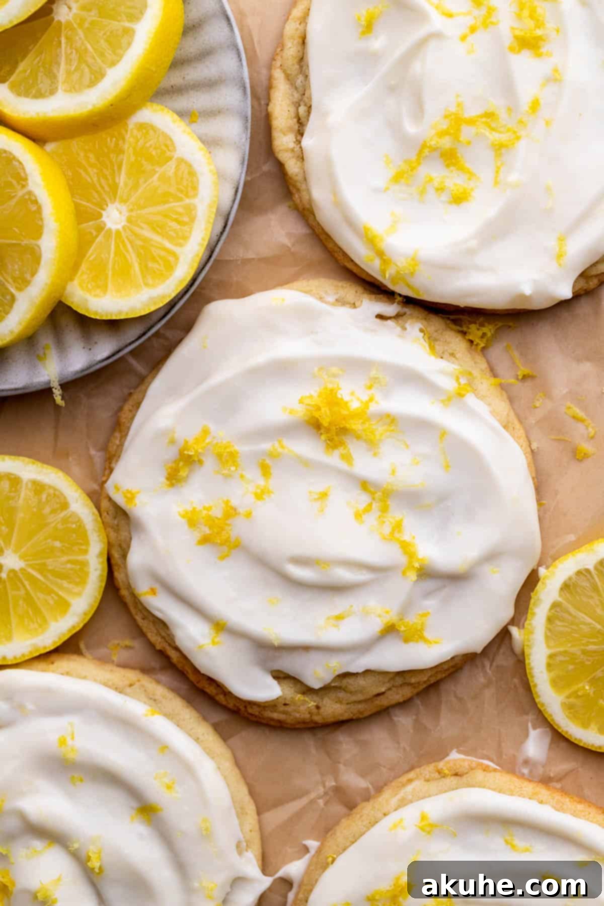 Zesty Lemon Bites 10 Close-up view of frosted lemon cookies, garnished with extra zest.